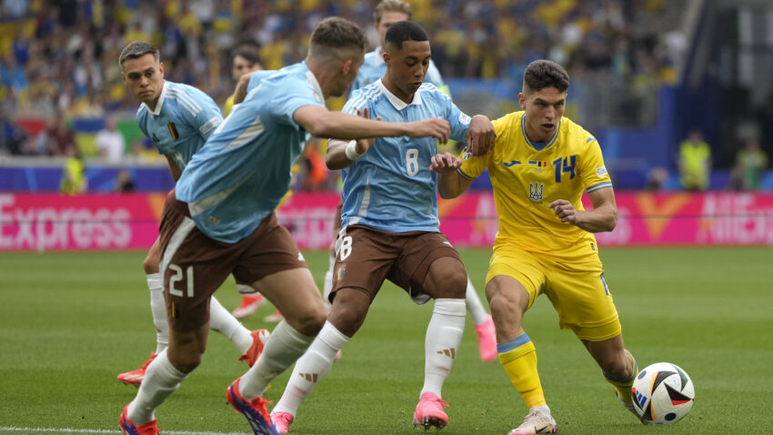 Belgium go through with goalless draw