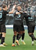 Napoli impress in Rome to keep title push alive